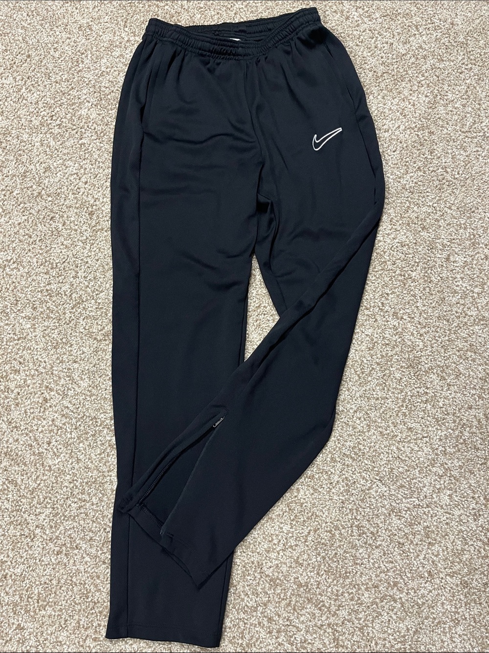 Nike kids size XL Black Track Pants with White Swoosh Logo, zipper pockets